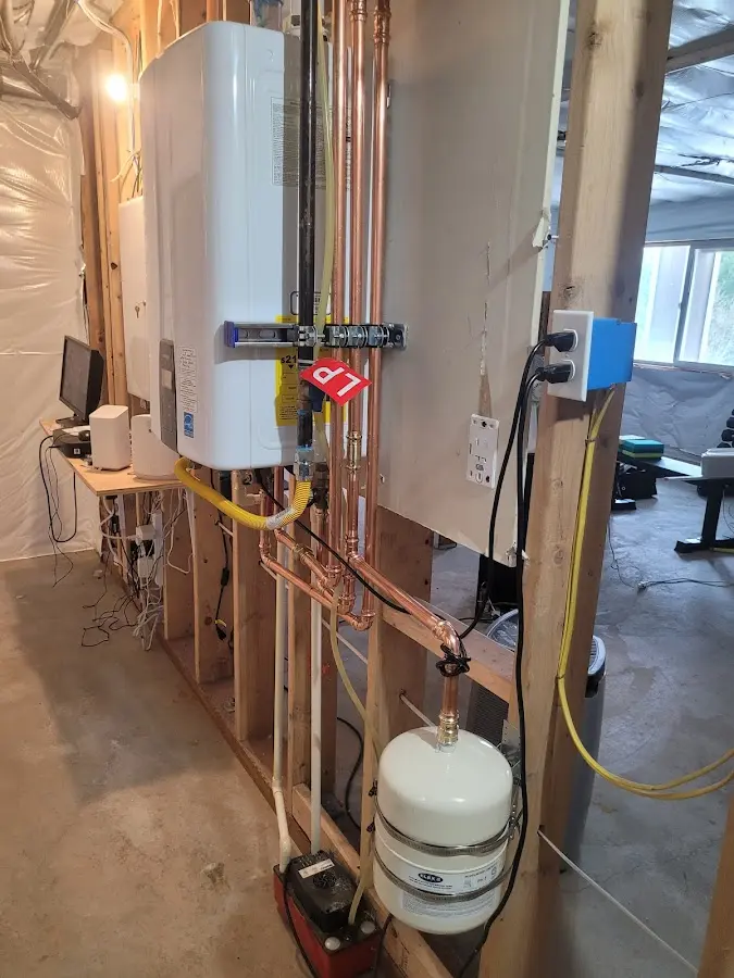 Licensed plumber repairing a kitchen sink in Hudson